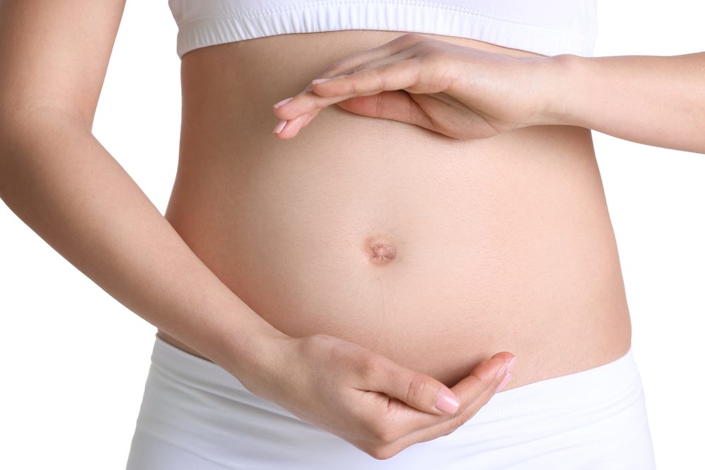 Pregnant woman on white background 
